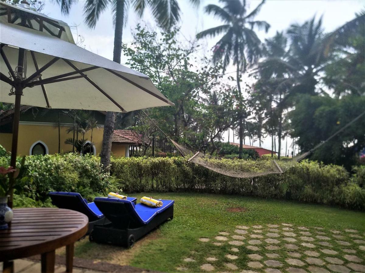 ทัช ฮอลิเดย์ วิลเลจ รีสอร์ต แอนด์ สปา กัว Hotel แคนโดลิม ภายนอก รูปภาพ The resort's garden